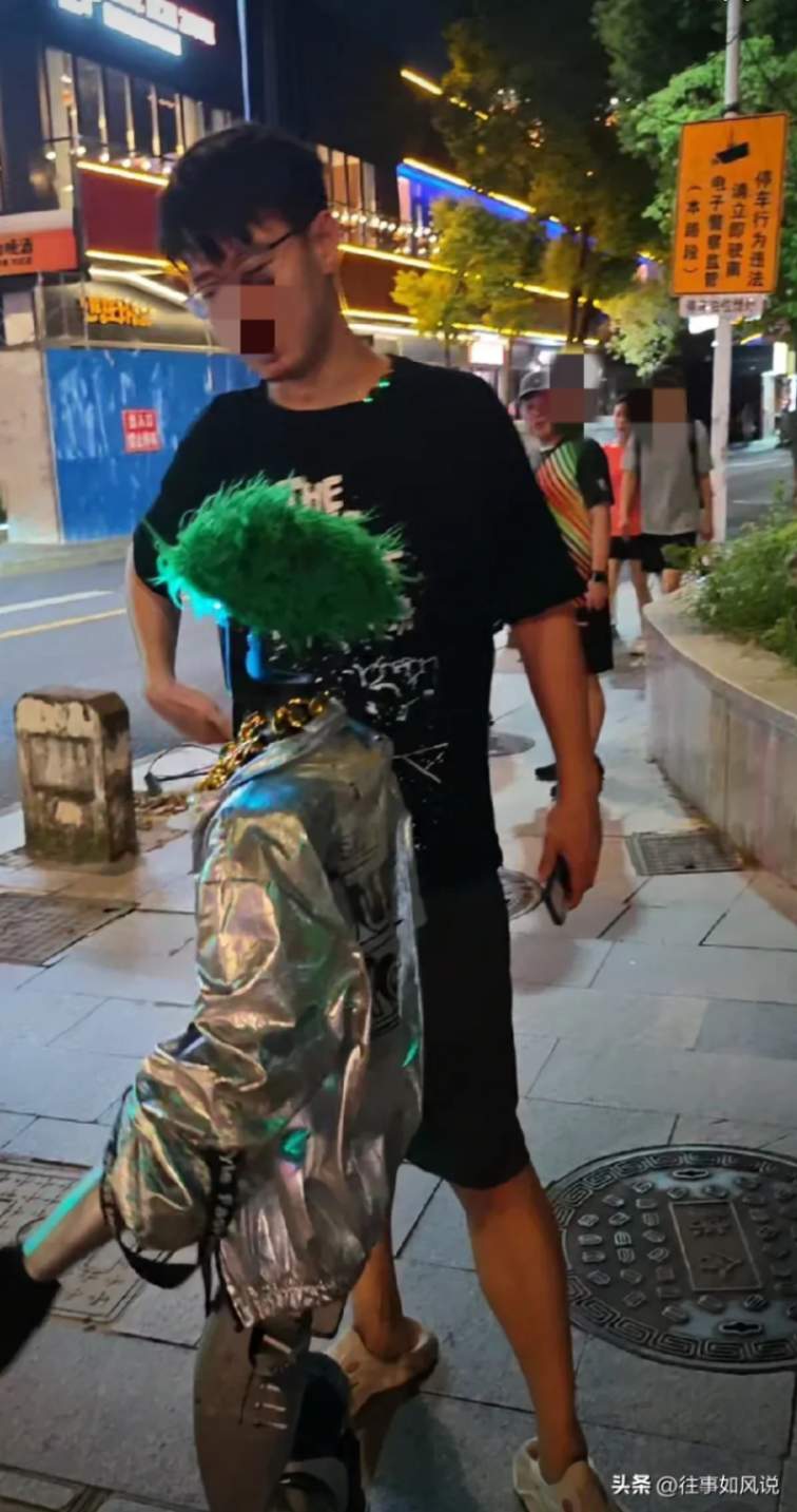 Man Strolls with Robot on the Street