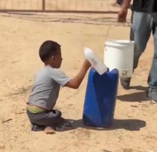 Disabled Gaza Boy Crawls with Water Bucket in Search of Survival