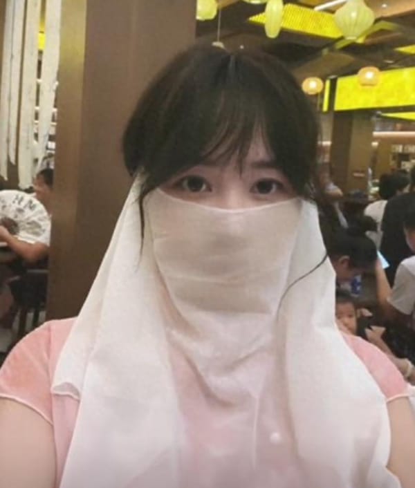Masked Woman’s Million-Yuan Bride Price Stunt Sparks Backlash